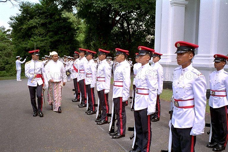 Ambassador-designate of Myanmar, U Phone Myint inspecting the Guard of Honour during an ambassador credentialing ceremony in the Istana