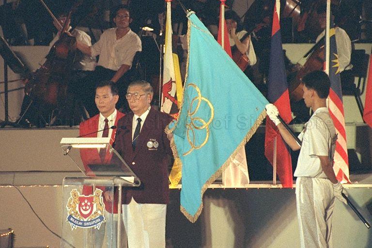 Swimmer Ang Peng Siong (left) and secretary of Singapore Amateur Swimming Association Woon Sui Kut taking the Games pledges on behalf of the athletes and officials during opening ceremony of 17th Southeast Asian (SEA) Games at National Stadium in Kallang