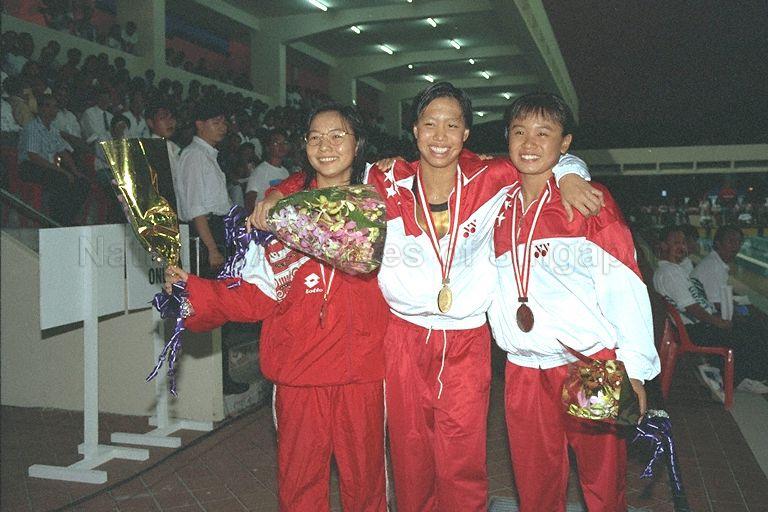 Group photograph of winners of women's 100 metres freestyle swimming event, from right, Eadelin Lim (Singapore, bronze medal), Joscelin Yeo (Singapore, gold medal) and Meitri Widya Pangestika (Indonesia, silver medal) during 17th Southeast Asian (SEA) Games at Toa Payoh Swimming Complex