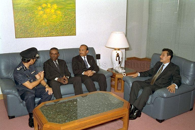 Malaysia's Inspector General of Police (IGP) Tun Mohammed Hanif Bin Omar (second from right) with Minister for Law and for Home Affairs, Professor S Jayakumar (second from left) during a courtesy call at the Ministry of Home Affairs, Raffles City Tower. &nbsp;Tun Mohammed Hanif is in Singapore to receive the Distinguished Service Order award from President Wee Kim Wee in recognition of his outstanding contribution in fostering closer ties and co-operation between the Royal Malaysia Police and the Singapore Police Force.