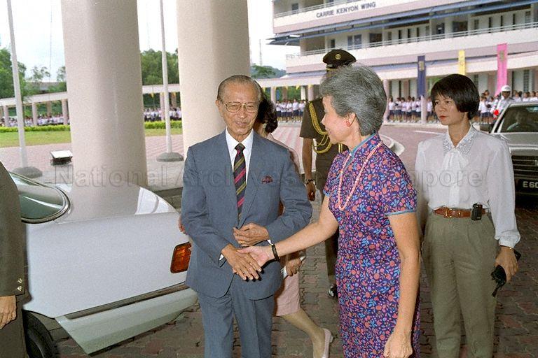 Principal of Methodist Girl's School, Anna Tham, receiving President Wee Kim Wee before the school's official opening and dedication ceremony at 11 Blackmore Drive