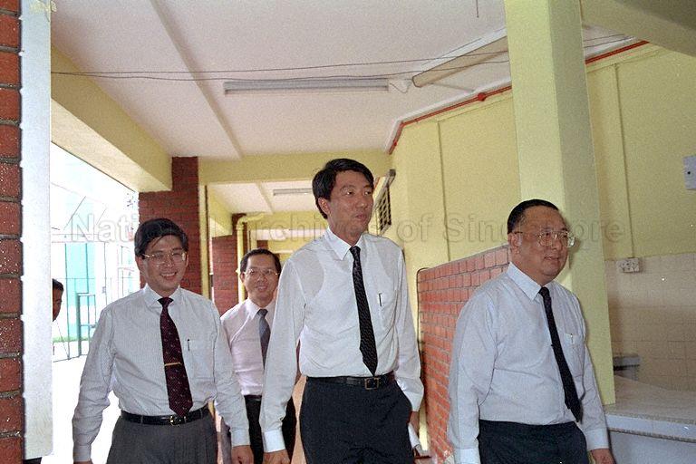 Minister of State for Finance and Communications Commodore (Reservist) Teo Chee Hean accompanied by Chairman of Economic Development Board Ngiam Tong Dow (right) arriving for launch of "Invest Singapore" exhibition at Khe Bong Community Centre Hall, Toa Payoh