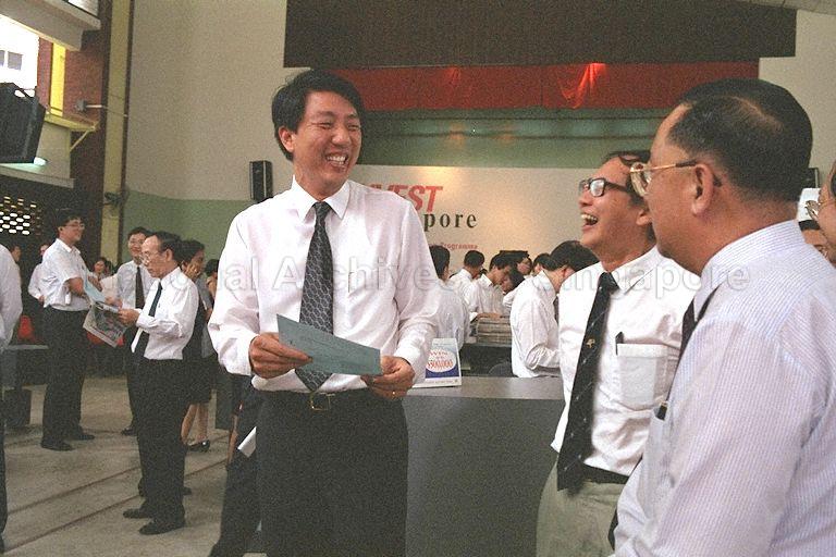 Minister of State (MOS) for Finance and Communications Commodore (Reservist) Teo Chee Hean (left) in conversation with Chairman of Economic Development Board Ngiam Tong Dow (right) and guest during launch of "Invest Singapore" exhibition held at Khe Bong Community Centre Hall, Toa Payoh