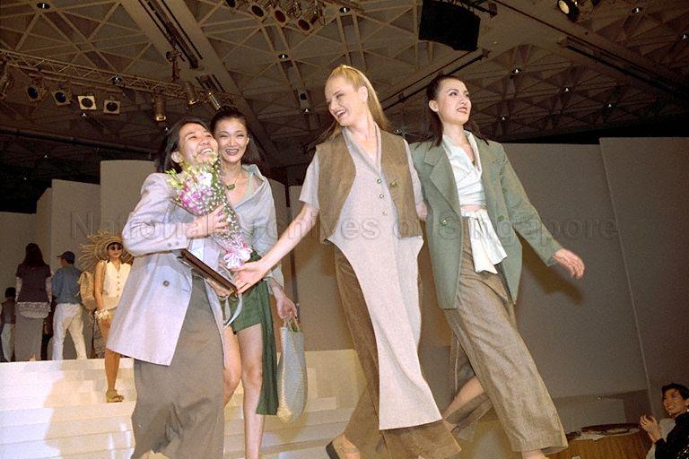Asean Young Designer winner Ms Gyn Choo (with flowers) and models wearing outfits designed by her taking to the catwalk again after Ms Choo's win during Asean Young Designers contest and show held at Raffles Ballroom, Westin