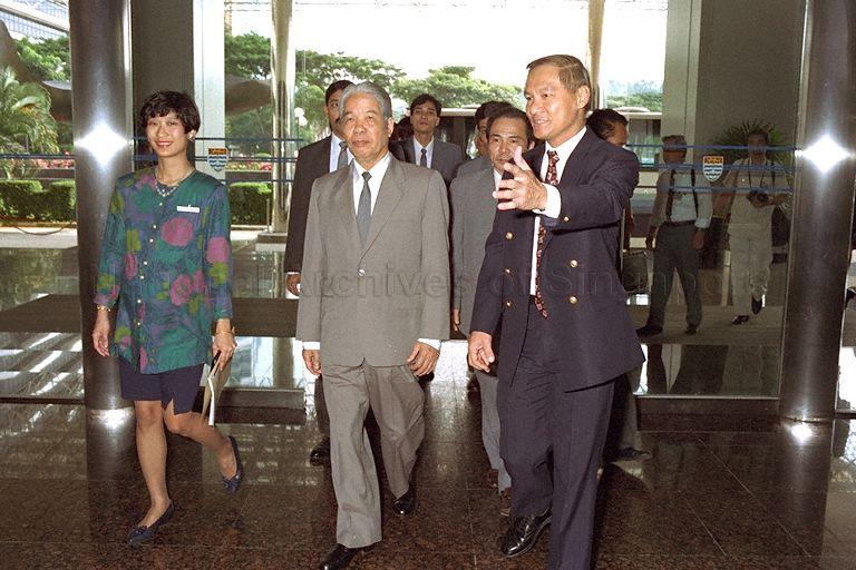 General Secretary of the Central Committee of the Communist Party of Vietnam (CPV) Do Muoi (left) is received by Executive Director of the Port of Singapore Authority (PSA) Commodore James Leo Chin Lian upon his arrival for a briefing at PSA Building, Alexandra Road