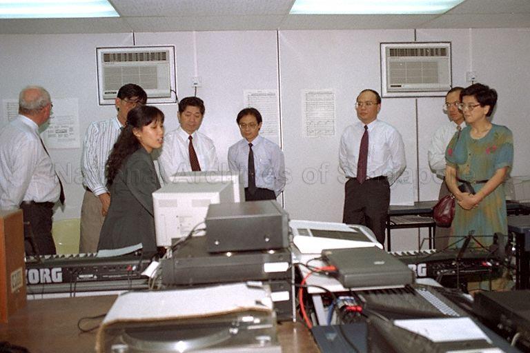China's Minister for Culture Liu Zhongde (back row, third from left) taking a guided tour of LaSalle-SIA College of the Arts led by President and Founder, Brother Joseph McNally (left, back to camera) at 90 Goodman Road