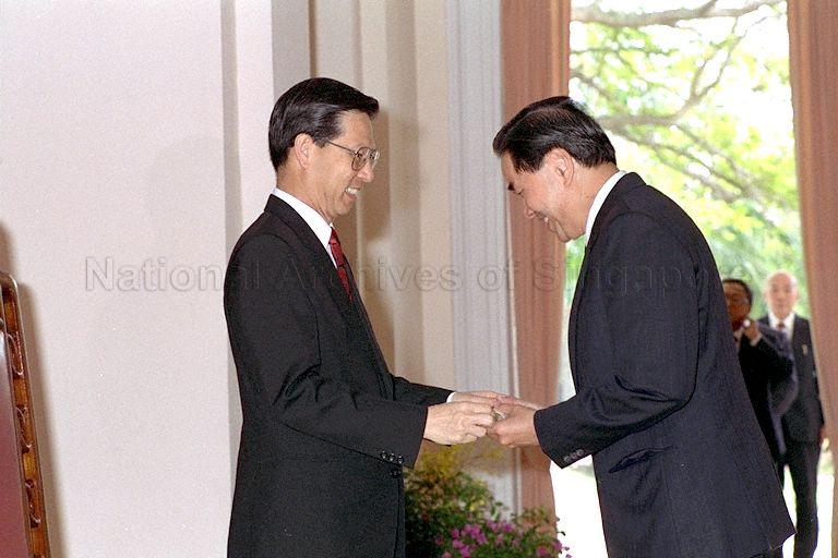 Tan Kah Hoe, PBM receiving his Warrant of Appointment from President Ong Teng Cheong during the ceremonial appointment of (JPs) in the Istana. &nbsp;Tan Kah Hoe received the Public Service Award in the 1987 National Day Awards.