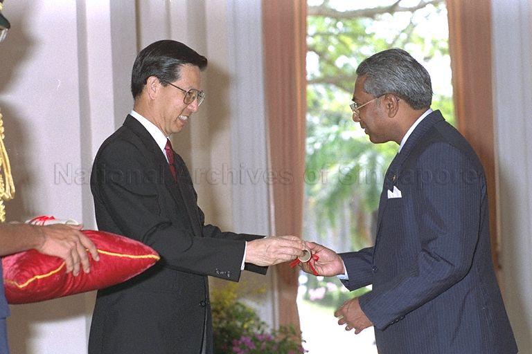 Dr Ivor Gunaseelan Thevanthasan receiving his Warrant of Appointment from President Ong Teng Cheong during the ceremonial appointment of Justices of the Peace (JPs) in the Istana