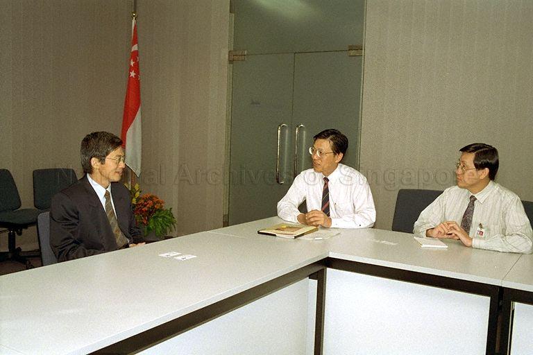 Deputy Director-General (Airport Management) of the Civil Aviation Authority of Singapore (CAAS) Ho Beng Huat (centre) with director in the governor's office at Bank of Thailand, Dr Pisit Leeahtam during a meeting at CAAS, Terminal 2, Singapore Changi Airport