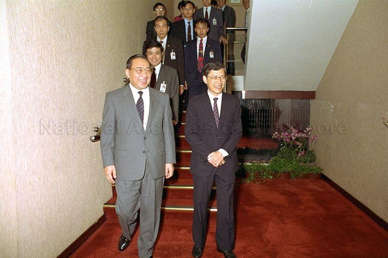 Vice-Premier of the People's Republic of China (PRC) Li Lanqing (left) is received by Minister for Education Lee Yock Suan upon his arrival at Singapore Changi Airport