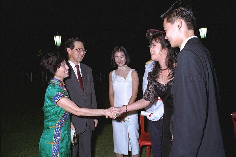 President Ong Teng Cheong and First Lady Mrs Ong Siew May congratulating President's scholars Sim Ann (shaking hands with First Lady), Low Tuan Yee (facing camera), Barrie Tan (shown from the side) and Ong Tze Ch'in (partially hidden) following the President's Scholarship presentation ceremony in the Istana