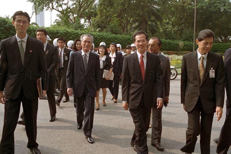 Japanese Prime Minister Tomiichi Murayama, accompanied by Minister for Trade and Industry Yeo Cheow Tong and Director of Protocol of Ministry of Foreign Affairs Mushahid Ali (second from right, partially hidden), making their way to Singapore Changi Airport Terminal 1 VIP Complex where the Japanese Premier departs for home at the end of his three-day official visit