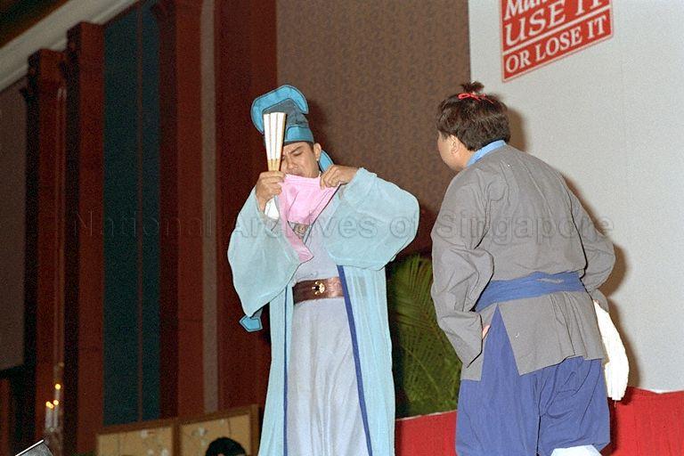 Television Corporation of Singapore artistes Huang Wenyong and Jimmy Nah (back to camera) performing at gala charity dinner during launch of Speak Mandarin Campaign at the Shangri-La Hotel