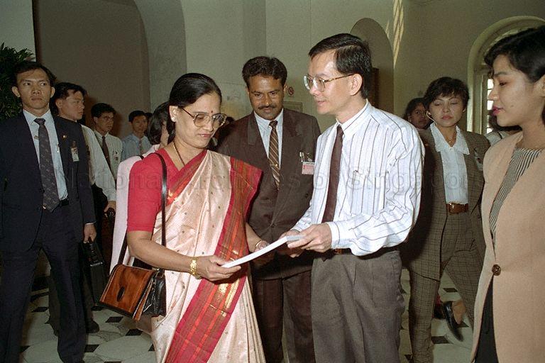 Ms Shrimati Vani Devi, daughter of Indian Prime Minister P V Narasimha, being presented with a book on an exhibition from "China War and Ritual: Treasures of the Warring States" by Manager of Empress Place Museum Leong Weng Kee during her visit to the museum