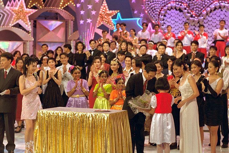 President Ong Teng Cheong receiving a bouquet of flowers during the President's Star Charity show by Television Corporation of Singapore (TCS) artistes held in the TCS theatre
