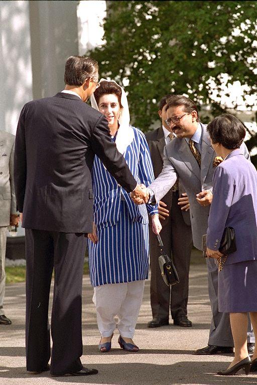 Pakistani Prime Minister Benazir Bhutto and her husband, Mr Asif Ali Zardari, being greeted by Prime Minister Goh Chok Tong (back to camera) upon arrival at Istana where the welcome ceremony is held