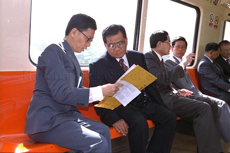 (From left) Chairman of Singapore Mass Rapid Transit (SMRT) Goh Kim Leong, Chairman of the State Law and Order Restoration Council and Prime Minister of the Union of Myanmar Senior General Than Shwe, Minister for National Development and Second Minister for Foreign Affairs Lim Hng Kiang and Secretary One of State Law and Order Restoration Council of Myanmar Lieutenant General Khin Nyunt taking train ride from Jurong East station to City Hall station