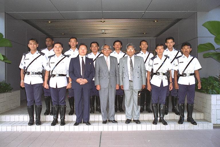 Group photograph of Mongolian Prime Minister Puntsagiin Jasrai with traffic police officers at Singapore Changi Airport before his departure at the end of a three-day official visit. Also in the picture is Mongolian Minister of Trade and Industry Tsevegmidiin Tsogt (third from right).