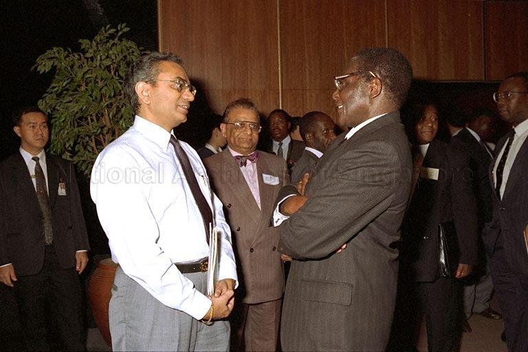 Zimbabwean President Robert G Mugabe conversing with a delegate at the Trade and Investment Forum on Zimbabwe organised by the Trade Development Board (TDB) at Mandarin Singapore.  The Zimbabwean President was here on a three-day official visit accompanied by prominent businessmen and government officials.