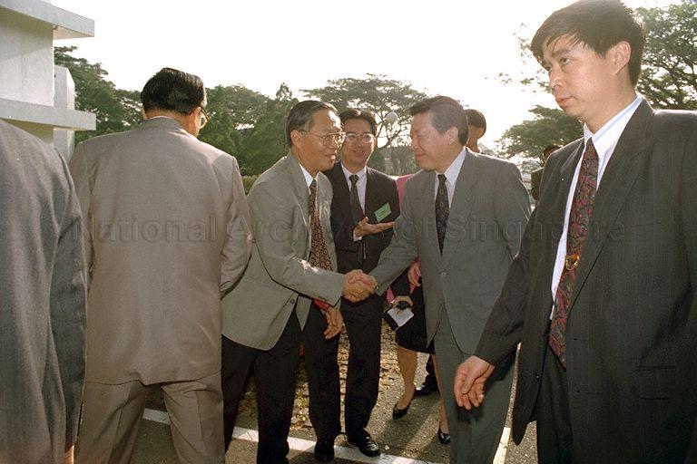 Professor John Wong, Director of the Institute of East Asian Political Economy (IEAPE) greeting China's Communist Party propaganda chief, Ding Guangen arriving for a visit to IEAPE at National University of Singapore