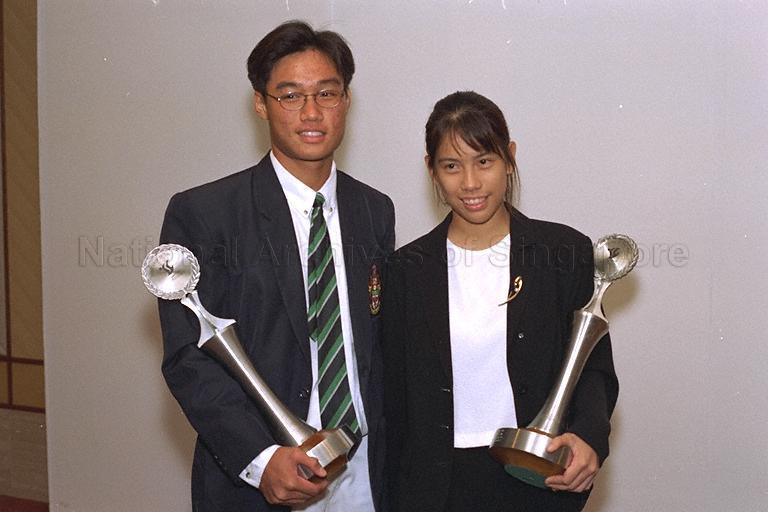 Sportsgirl of the Year Wong Maye-E and Sportsboy of the Year Tan Wearn Haw with their awards posing for photographs during Sport Awards Night 1996 at Raffles Ballroom, Westin Stamford