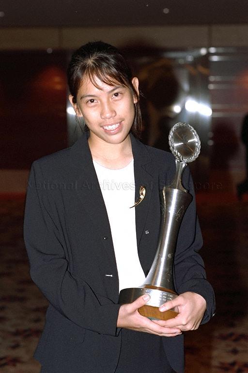 Sportsgirl of the Year Wong Maye-E with her award posing for photographs during Sport Awards Night 1996 at Raffles Ballroom, Westin Stamford