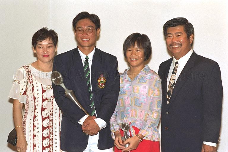Sportsboy of the Year Tan Wearn Haw with family members posing for photographs during Sport Awards Night 1996 at Raffles Ballroom, Westin Stamford