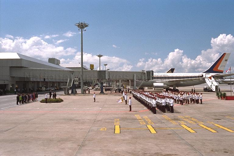 Prime Minister of Thailand Banharn Silpa-archa taking the salute during the official welcome ceremony on the tarmac of Singapore Changi Airport Terminal 2