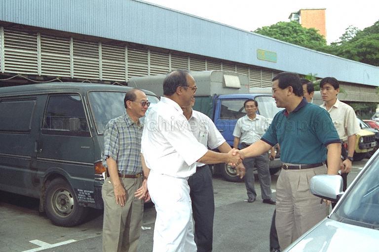 Minister for Community Development Abdullah Tarmugi being greeted by Member of Parliament (Tanjong Pagar Group Representation Constituency [GRC]) Dr S Vasoo upon arriving at Bukit Merah View market for his community visit to Radin Mas Division of Tanjong Pagar GRC