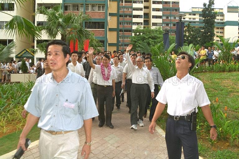 Deputy Prime Minister and Minister for Defence Dr Tony Tan Keng Yam (right) and Member of Parliament for Chua Chu Kang Associate Professor Low Seow Chay (left) waving to residents during the Deputy Prime Minister's community visit to Chua Chu Kang constituency.