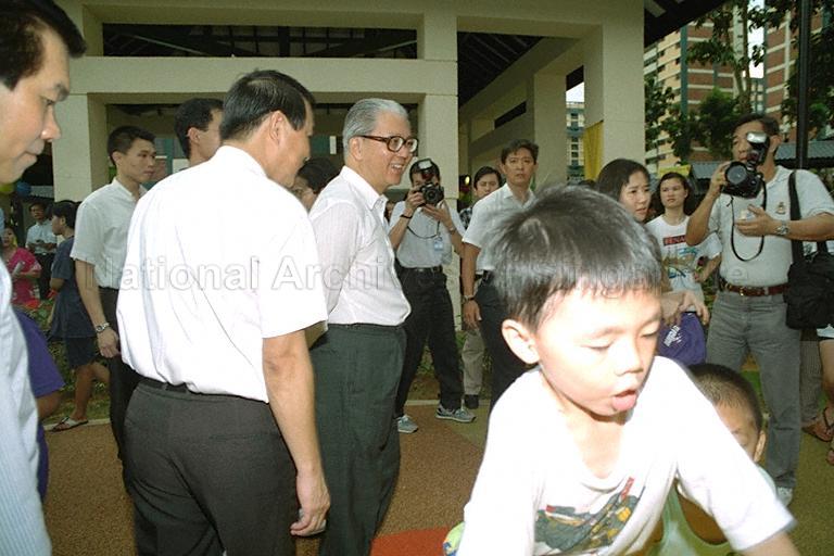 Deputy Prime Minister and Minister for Defence Dr Tony Tan Keng Yam (centre) with residents during his community visit to Chua Chu Kang constituency. He is accompanied by Member of Parliament for Chua Chu Kang Associate Professor Low Seow Chay (left).