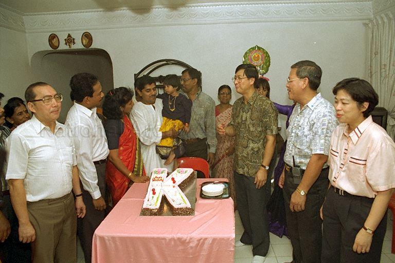Minister without Portfolio Lim Boon Heng (third from right) together with second adviser to grassroots organisation in Aljunied Group Representation Constituency (GRC) Mrs Lim Hwee Hua (right), Member of Parliament for Aljunied GRC Chin Harn Tong (left) and Parliamentary Secretary to Ministry of Information and the Arts Mohamad Maidin Bin Packer Mohd (second from left) singing birthday song during the Minister's house visit while on community visit to Kampong Ubi division of Aljunied Group Representation Constituency