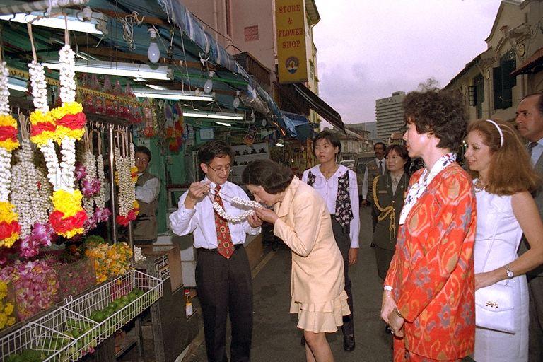 Wife of Mexican President Nilda Patricia Velasco smelling a flower-garland during a guided tour of Little India, Serangoon Road. &nbsp;She is part of a 70-man delegation accompanying President Ernesto Zedillo who is here on a three-day official visit.