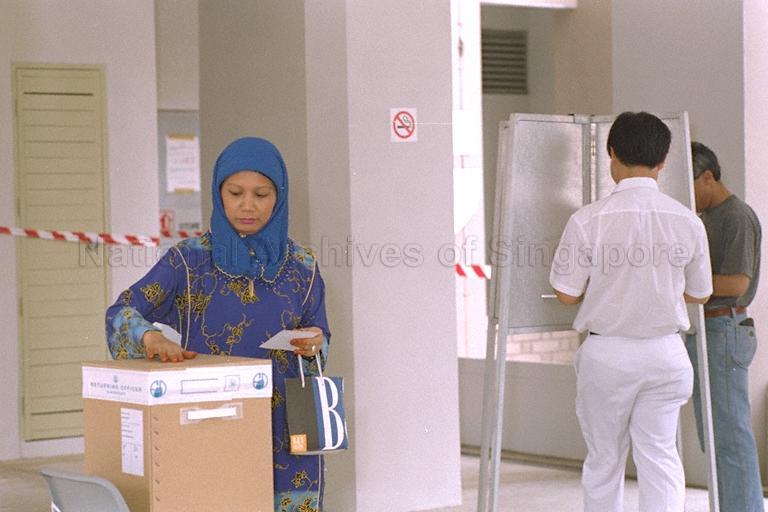 Voters casting their votes at Polling Station at Block 355, Choa Chu Kang Central