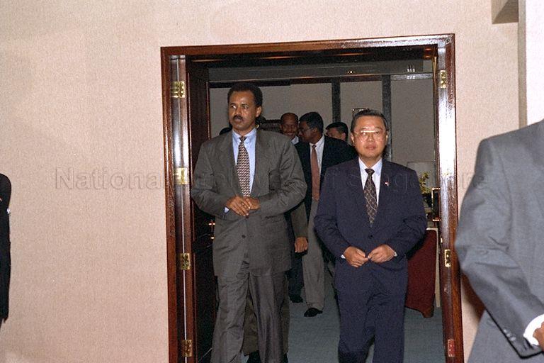 President Isaias Afwerki of Eritrea arriving at Singapore Changi Airport for a four-day visit, the first by a head of state if the East African country. With him is Ministry of Foreign Affairs' Chief of Protocol Tan Keng Jin.