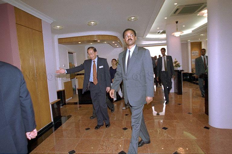 President Isaias Afwerki of Eritrea with Chief Executive Officer of Housing and Development Board (HDB) Tan Guong Ching at HDB Toa Payoh branch office at block 81, Lorong 4, where the visiting head of state is shown the panoramic view of HDB estates from the 25th storey