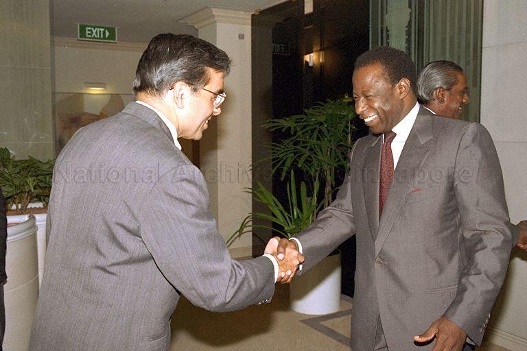 An official of Ministry of Foreign Affairs greeting Foreign Minister of Ivory Coast (Cote D'Ivoire) Amara Essy for bilateral meeting between Foreign Ministers at Ministry of Foreign Affairs, Raffles City Tower
