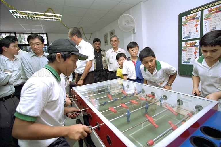 Boys playing a game at Marine Parade Boys' Club during opening of the club's premises at Block 35, Marine Crescent, which is officiated by Prime Minister Goh Chok Tong (back with face partially hidden)