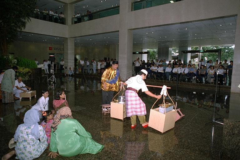 Malay cultural group Sriwana performing an excerpt from the musical, Geylang Serai Karam, for a lunchtime crowd at Port of Singapore Authority (PSA) Building atrium. The musical was staged at Festival of Asian Performing Arts (FAPA).
