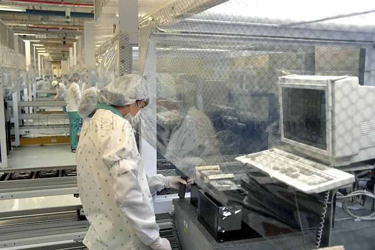 View of staff working at Seagate Technology International located at 7000 Ang Mo Kio Avenue 5. United States Secretary of State Madeleine Albright visited the plant during her two-day visit to Singapore.