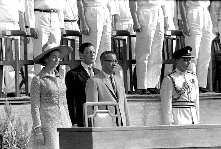 National Day Parade 1969 at the Padang -- View of Princess Alexandra, cousin and representative of Queen Elizabeth II, her husband Angus Ogilvy, Minister for Defence Lim Kim San, and Assistant Superintendent of Police and president's aide-de-camp Robert Woodworth during the playing of British national anthem "God Save The Queen"