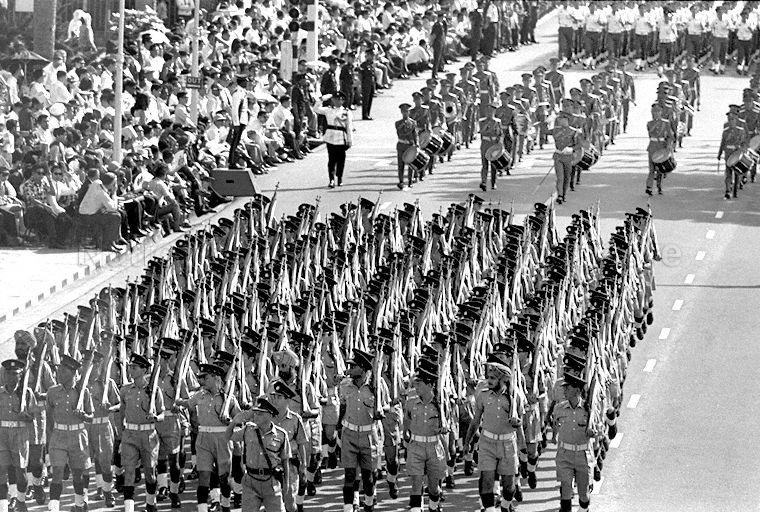 National Day Parade 1969 at the Padang -- View of Singapore Police Force contingent marching past City Hall