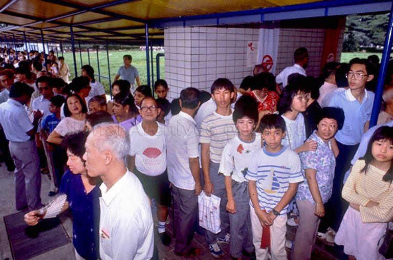 Commuters queueing up for the train ride during official opening of the Yio Chu Kang-Toa Payoh line of the Mass Rapid Transit system