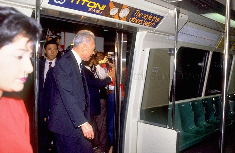Prime Minister (PM) Lee Kuan Yew boarding the Mass Rapid Transit (MRT) carriage for a celebration ride after PM opens the MRT system