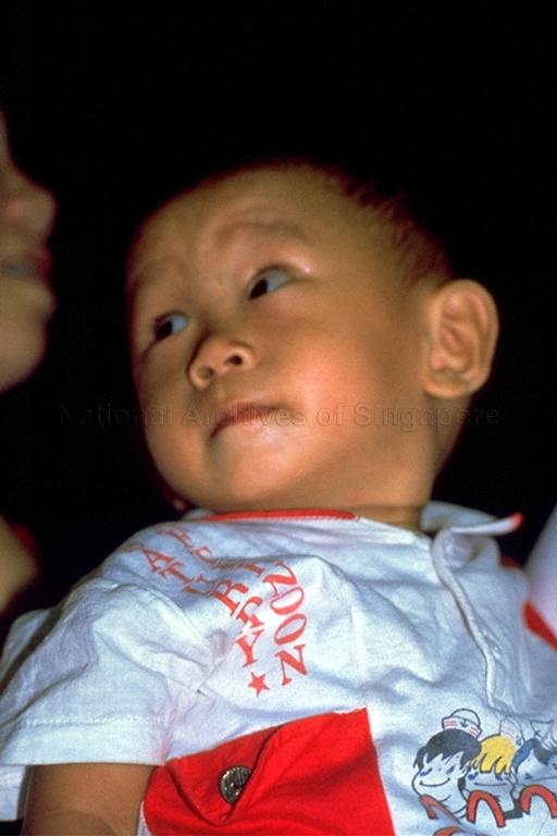 A child at a Chinese wayang (opera) performance