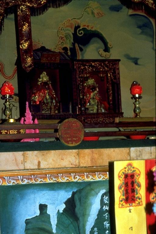View of deities at altar in Taoist temple