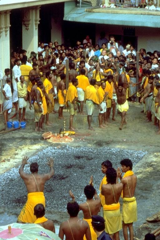 View of fire-walking ceremony at Sri Mariamman Temple during Thimithi Festival