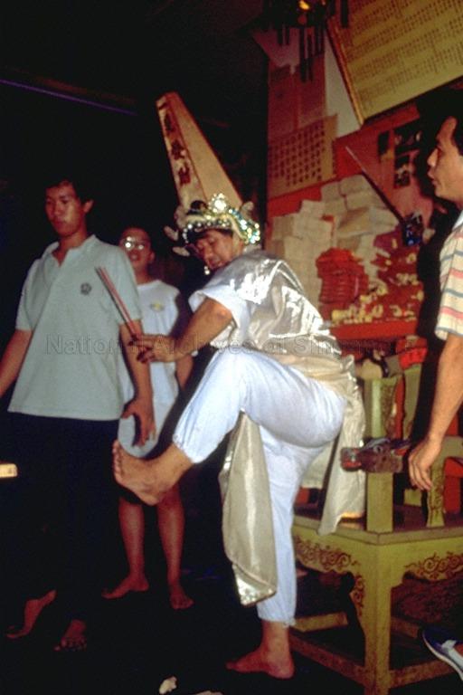 Medium (tangki) in a trance during ritual at Taoist temple