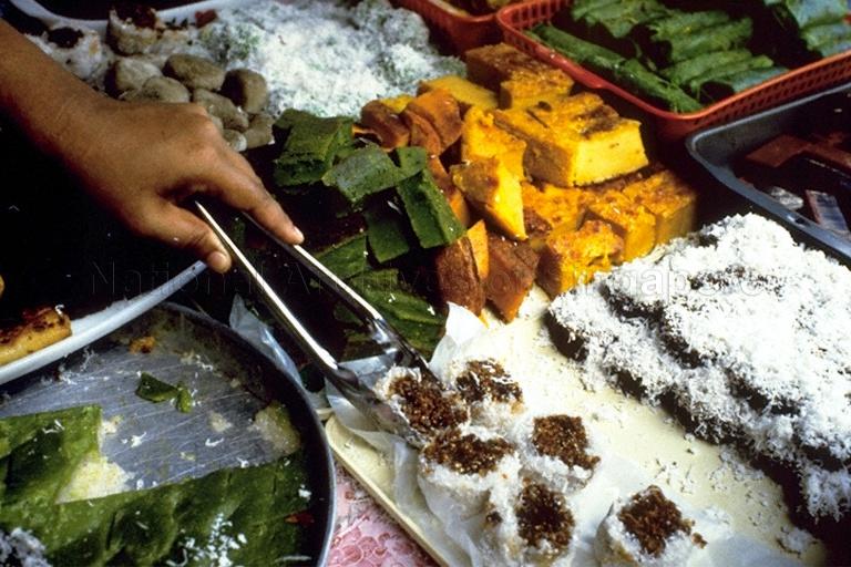 View of Malay kueh (bite-sized snack and dessert foods being sold at foodstall