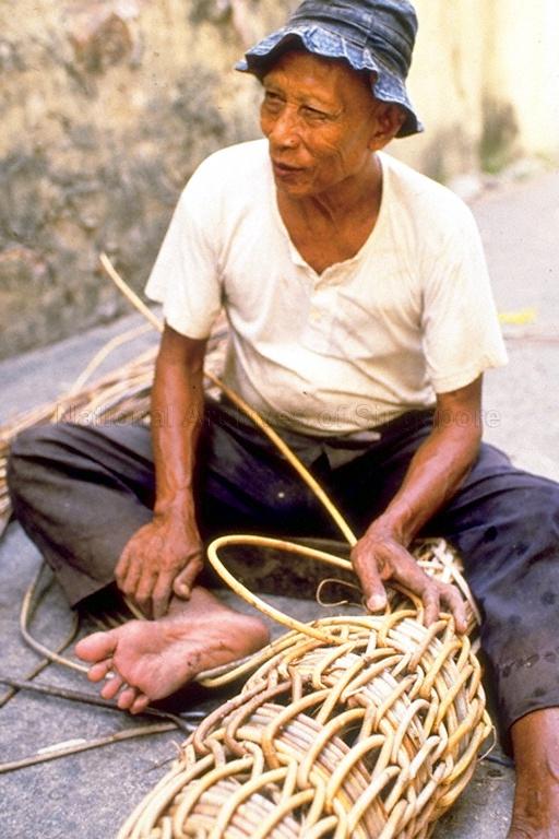 Man making rattan fender at H M Ashik Mokri General Order Suppliers Rattan Fenders and Coir Fenders located at 23 Mohamed Ali Lane